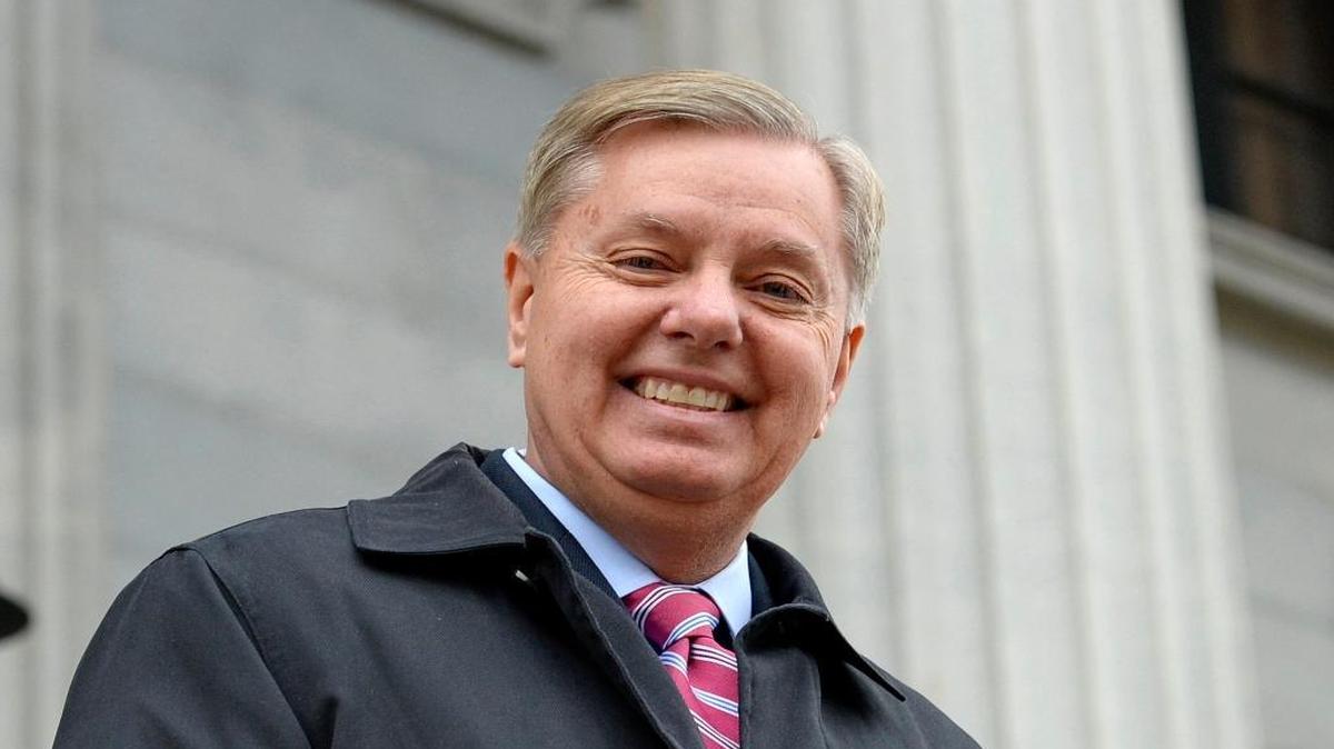 In this Jan. 14, 2015, photo, Sen. Lindsay Graham, R-S.C., walks down the steps of the State Capitol building in Columbia, S.C. Graham announced Monday that he’s ending his bid for the GOP presidential nomination.