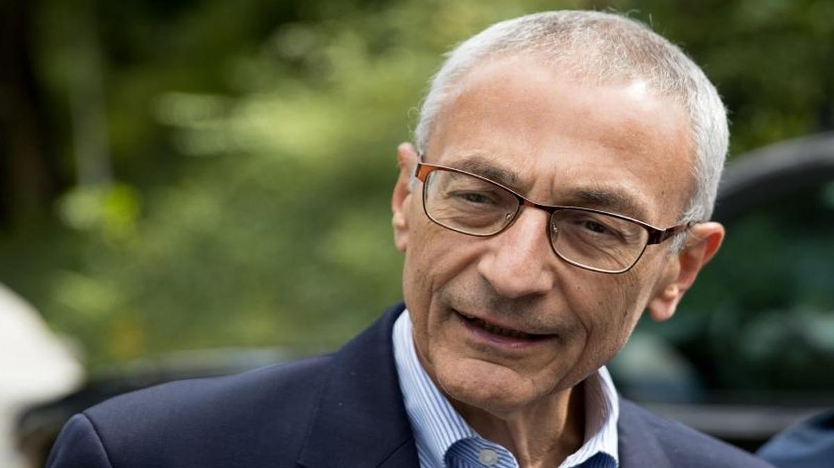 Clinton campaign manager John Podesta speaks to members of the media outside Democratic presidential candidate Hillary Clinton's home in Washington, Wednesday, Oct. 5, 2016.