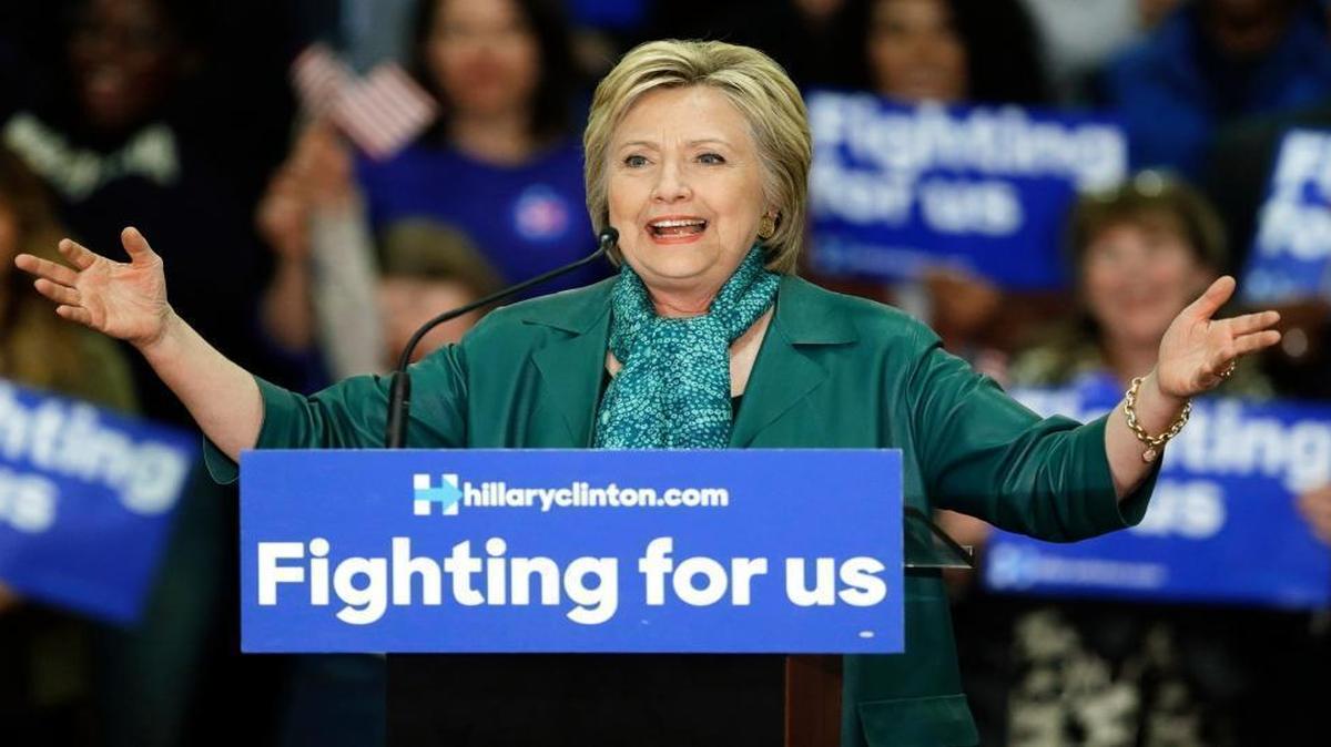 FILE - In this photo taken March 22, 2016, Democratic presidential candidate Hillary Clinton speaks during a campaign rally at Rainier Beach High School in Seattle. Tens of thousands of Democrats in Washington state will meet at schools, libraries and community centers at caucuses this weekend to voice their preference for the Democratic presidential nominee.