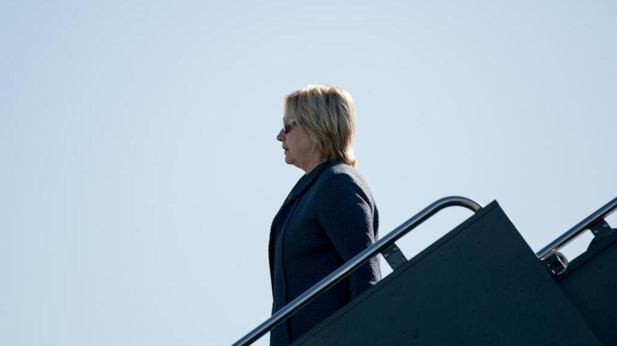 Democratic presidential candidate Hillary Clinton arrives at McCarran International Airport in Las Vegas, N.Y., Tuesday, Oct. 18, 2016, a day before the third presidential debate.