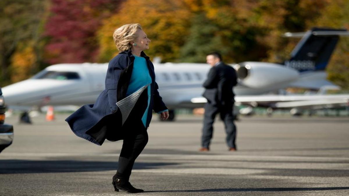 Democratic presidential candidate Hillary Clinton arrives to board her campaign plane at Westchester County Airport in White Plains, N.Y., Monday, Oct. 24, 2016, to travel to Manchester.