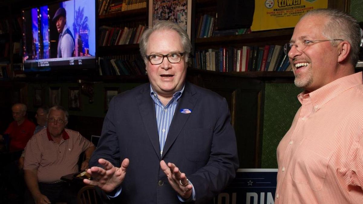 Congressman George Holding talks with Duane Cutlip upon his arrival on June 7, 2016, at the Hibernian in Raleigh, N.C.