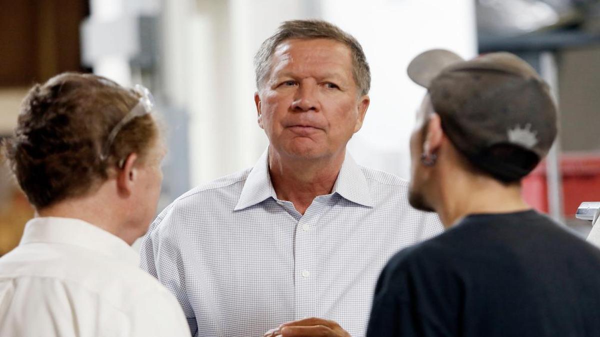 
Ohio Gov. John Kasich enters the race for the Republican presidential nomination Tuesday, July 21, 2015. He maintains that as governor of a state that's the "microcosm of the country" he's uniquely qualified to lead the nation. In photo, Kasich talks with employees at RP Abrasives, in Rochester, N.H., July 13, 2015.
