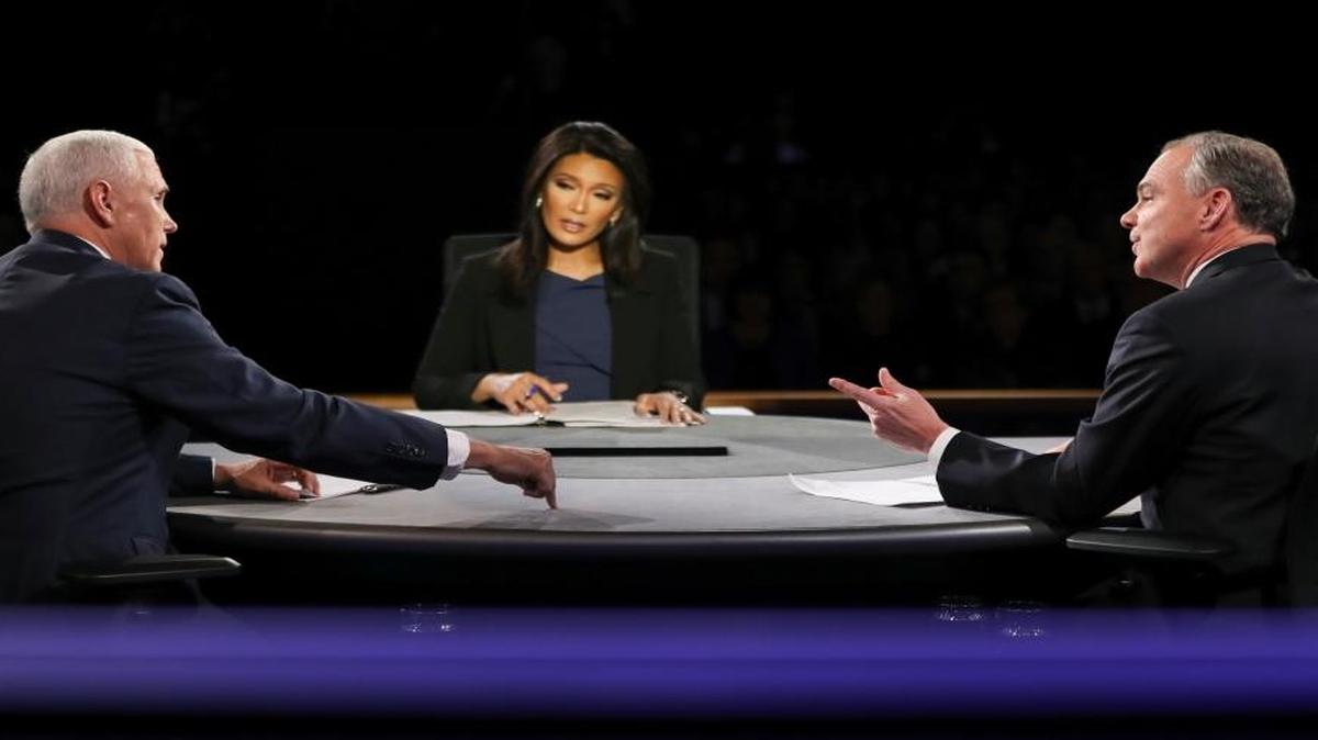 Republican vice-presidential nominee Gov. Mike Pence, left, and Democratic vice-presidential nominee Sen. Tim Kaine exchange opinions as Moderator Elaine Quijano of CBS News listens during the vice-presidential debate at Longwood University in Farmville, Va.
