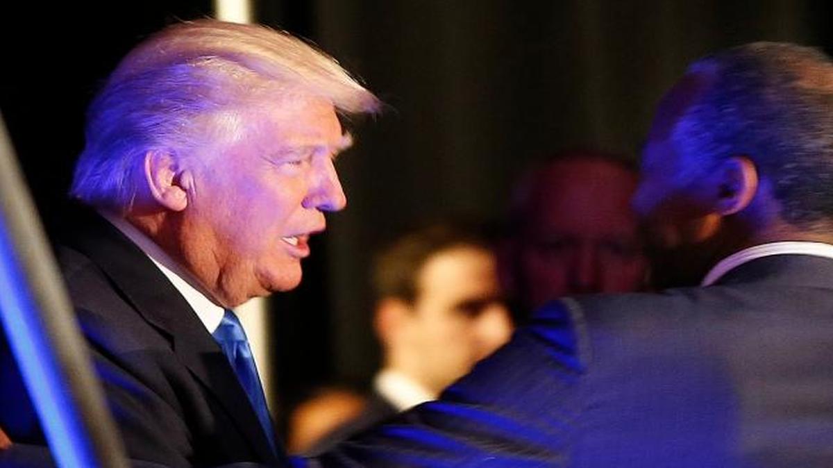Republican presidential candidate Donald Trump greets former presidential candidate Dr. Ben Carson as he arrives to speak at a campaign rally in Manchester, N.H., on Thursday, Aug. 25, 2016.