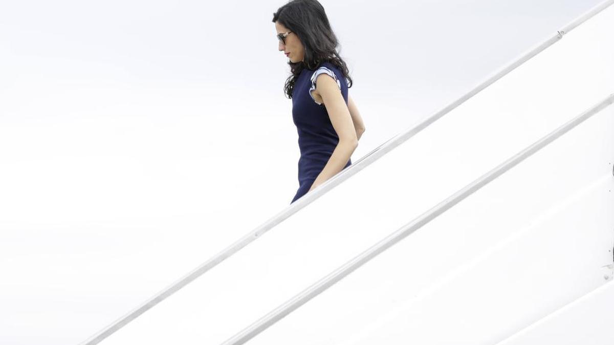 Huma Abedin, a senior aide for Democratic presidential candidate Hillary Clinton, walks off of Clinton's campaign plane Raleigh-Durham International Airport in Morrisville, N.C., Tuesday, Sept. 27, 2016.