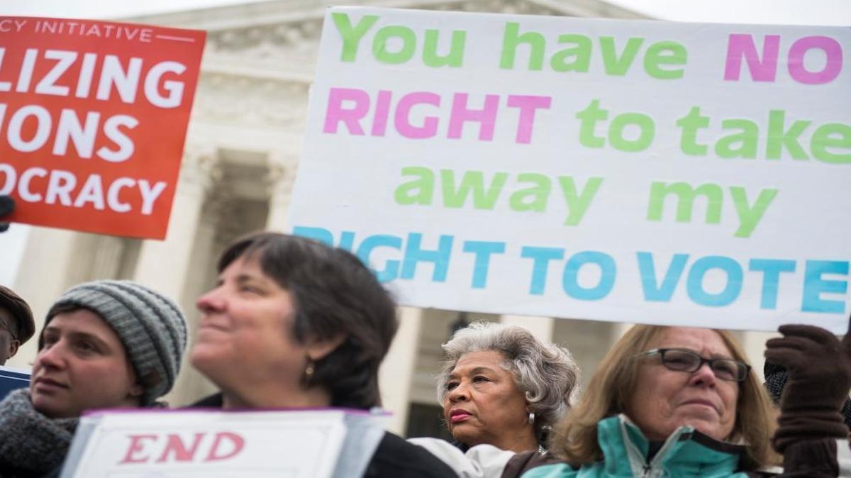 Rep. Joyce Beatty, D-Ohio, second from right, is seen during a rally outside the Supreme Court on January 10, 2018, to oppose Ohio's voter purging system. The court heard arguments on whether Ohio has been too strict in setting in motion a voter registration removal process if the individual hasen't voted in a federal election for two years.