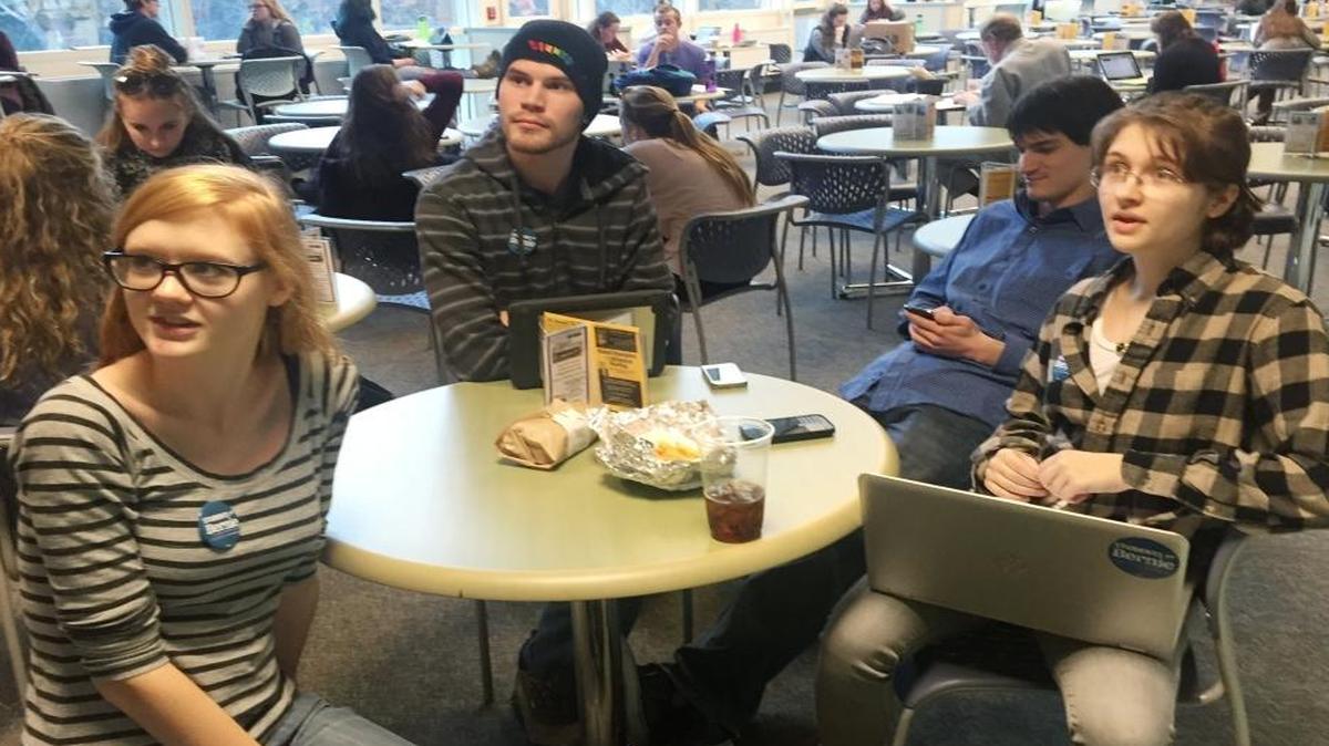 Students Molly Rose,Tim Pearson and Megan Roche explain why they are supporting Bernie Sanders for president at the University of New Hampshire, in r Durham, N.H., on Feb. 4, 2016.