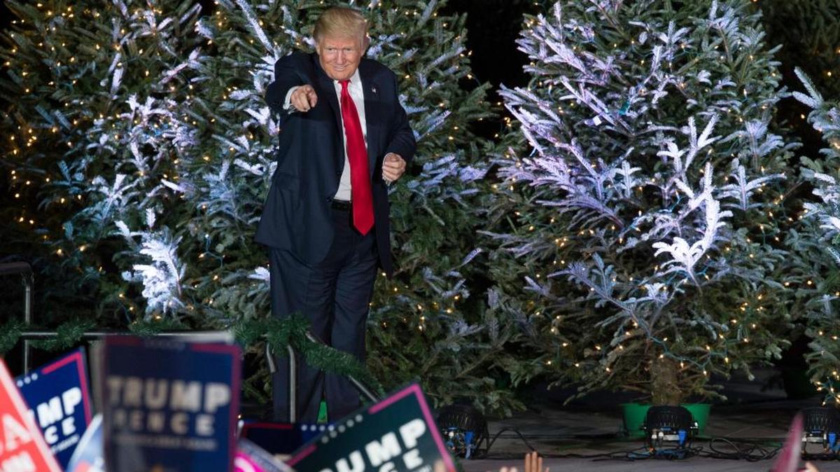 President-elect Donald Trump points into the audience after a rally in Orlando, Fla., Friday, Dec. 16, 2016.