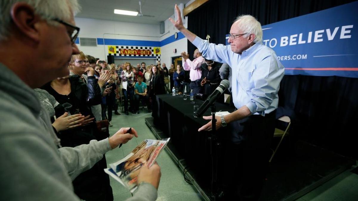 Democratic presidential candidate Bernie Sanders, an independent senator from Vermont, waves to supporters following a town hall meeting at Strawberry Hill Elementary School on Saturday, Dec. 12, 2015, in Anamosa, Iowa.