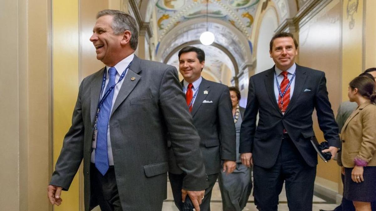 From left, Rep.-elect Mike Bost of Illinois, Rep.-elect David Rouzer of North Carolina and Rep.-elect Mark Walker of North Carolina leave an orientation luncheon for newly elected GOP members of the House on Capitol Hill in Washington, Nov. 17, 2014.