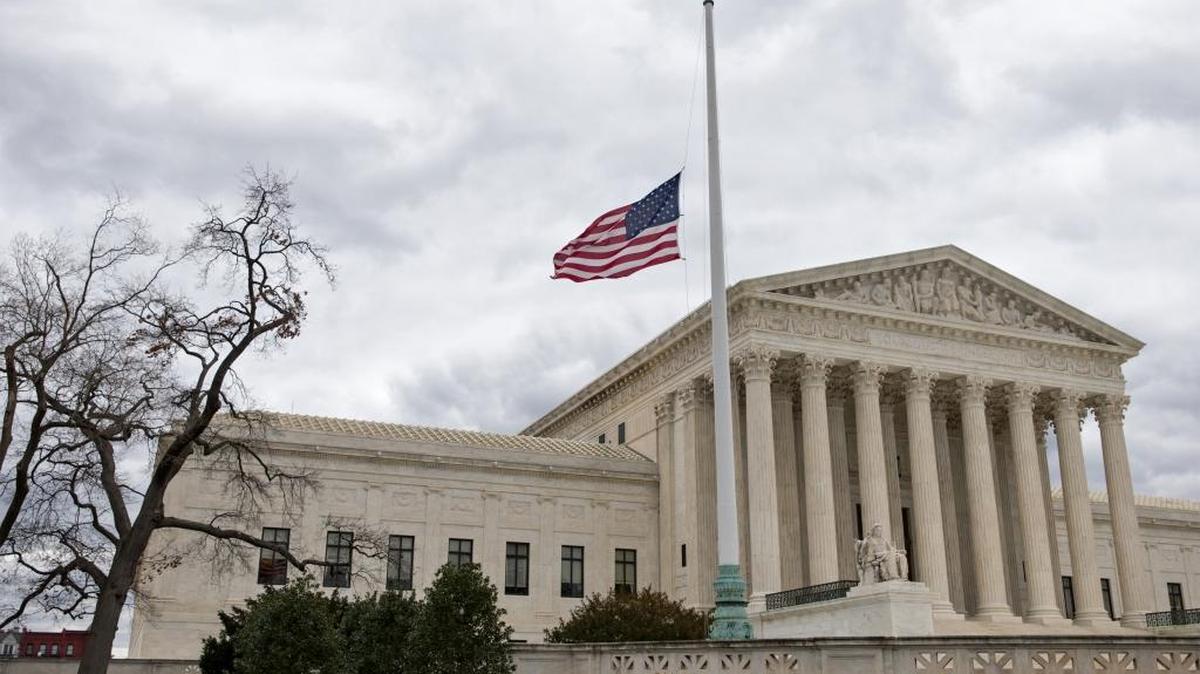 In this Feb. 25, 2016, file photo, a flag in the Supreme Court building's front plaza flies at half-staff in Washington, in honor of the late Justice Antonin Scalia.