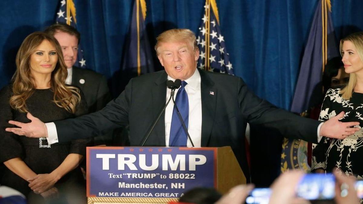 Republican presidential candidate, businessman Donald Trump speaks to supporters during a primary night rally, Tuesday, Feb. 9, 2016, in Manchester, N.H. At his side are his wife Melania Trump, left, and daughter Ivanka Trump, right.