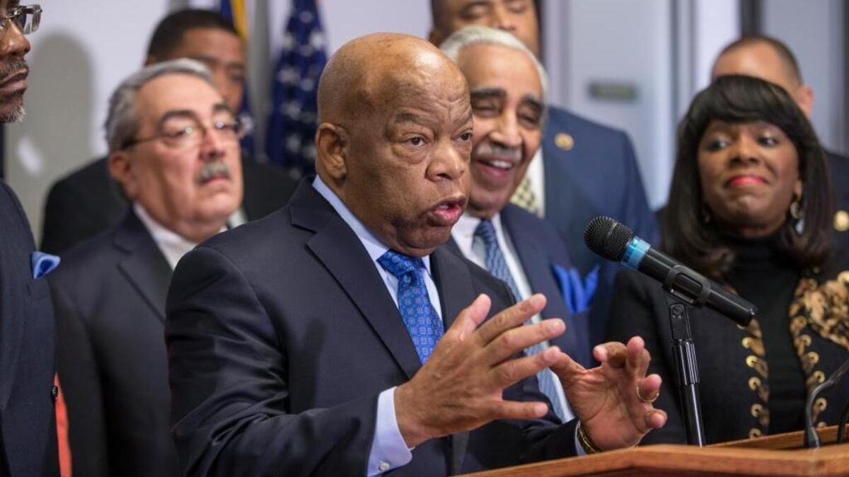 Rep. John Lewis, D-Ga., a leader of the civil rights movement, joins the Congressional Black Caucus Political Action Committee in endorsing Democratic Presidential candidate Hillary Clinton as prominent African-American Democrats rush to her aid ahead of the Feb. 27 Democratic primary in South Carolina, Thursday, Feb. 11, 2016, during a news conference on Capitol Hill in Washington.