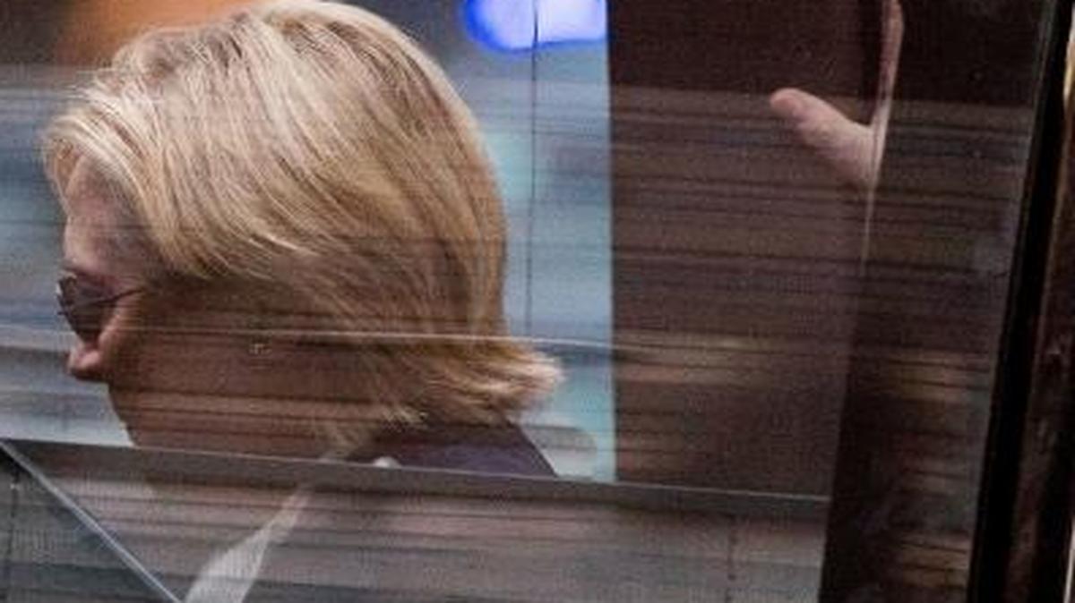 Democratic presidential candidate Hillary Clinton gets into a van as she leaves an apartment building Sunday, Sept. 11, 2016, in New York. Clinton's campaign said the Democratic presidential nominee left the 9/11 anniversary ceremony in New York early after feeling "overheated."