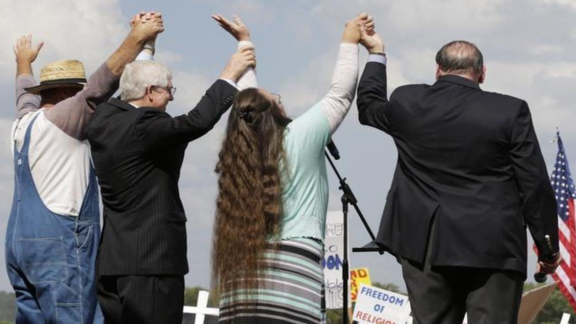 Joe Davis, Mat Staver, Kim Davis and Mike Huckabee, left to right, appear at a rally outside the Carter County Detention Center in Grayson, Ky., on Sept. 8, 2015.
