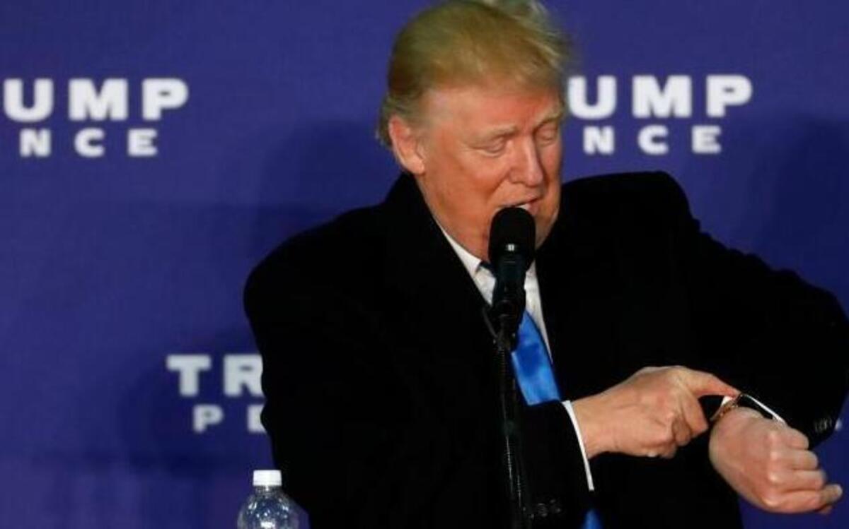 Republican presidential candidate Donald Trump looks at his watch while speaking at a rally Monday, Nov. 7, 2016 in Leesburg, Va. Trump was checking to see that it Monday, and only one more day before Election Day.