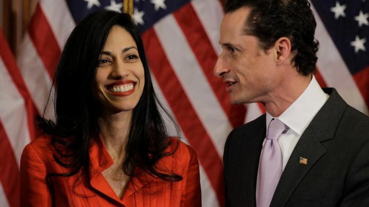 Rep. Anthony Weiner, D-N.Y., and his wife, Huma Abedin, aide to Secretary of State Hillary Rodham Clinton, are pictured after a ceremonial swearing in of the 112th Congress on Capitol Hill in Washington, Wednesday, Jan. 5, 2011.