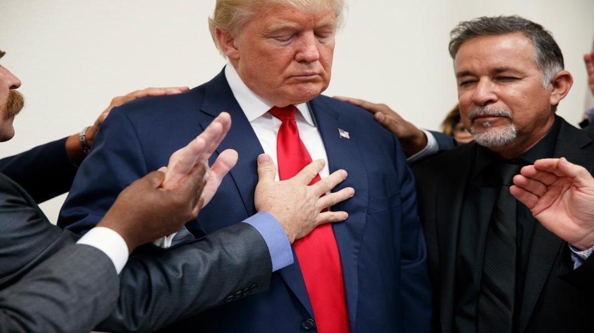 Pastors from the Las Vegas area pray with Republican presidential candidate Donald Trump during a visit to the International Church of Las Vegas and International Christian Academy on Wednesday, Oct. 5, 2016, in Las Vegas.