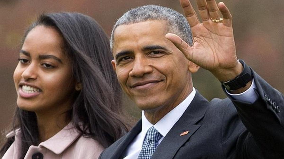 In this April 7, 2016, file photo, President Barack Obama and his daughter Malia walk across the South Lawn of the White for the short flight to Andrews Air Force Base. A milestone has arrived for Obama: Malia is graduating from high school. The 17-year-old receives her diploma from the private Sidwell Friends School on Friday, June 10, 2016.