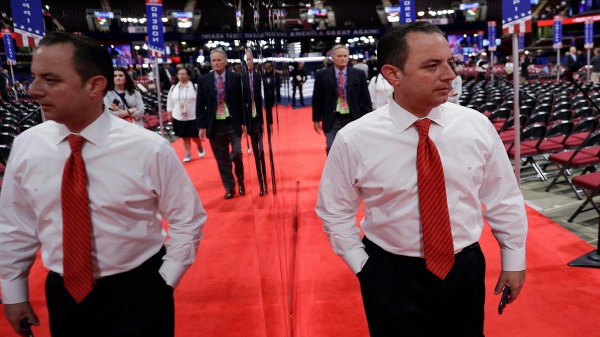 Reince Priebus, Chairman of the Republican National Committee, is reflected in a mirror as he walks the floor before the third day session of the Republican National Convention, Wednesday, July 20, 2016, in Cleveland. Some key organizations that keep tabs on the federal government and campaigns are complaining that they’ve been denied access to the Republican National Convention this week.