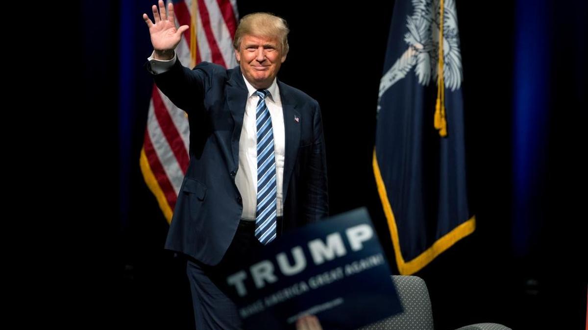 Republican presidential candidate Donald Trump waves as he walks onto the stage during a campaign stop Tuesday, Feb. 16, 2016, in Beaufort, S.C.