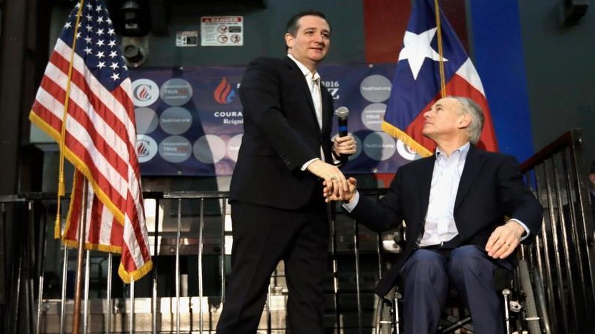 Republican presidential candidate, Sen. Ted Cruz, R-Texas shakes hands with Texas Gov. Greg Abbott at a Houston rally.