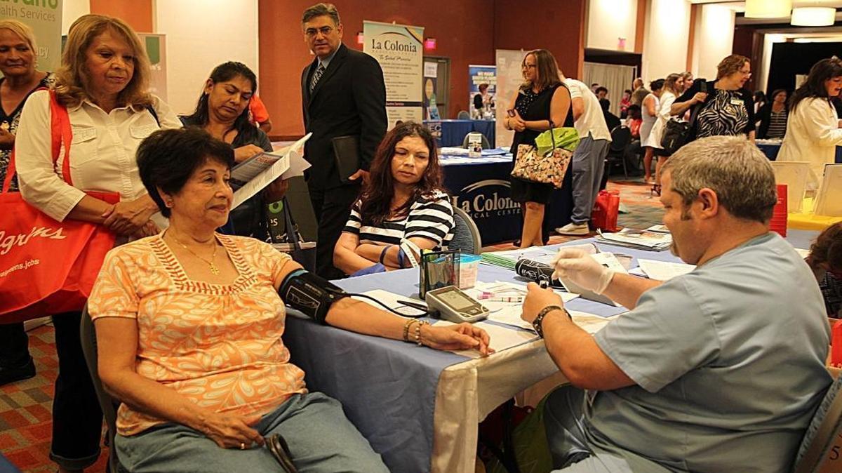 A blood pressure check at the South Florida Hispanic Chamber of Commerce Latino Health and Wellness Expo in 2015.