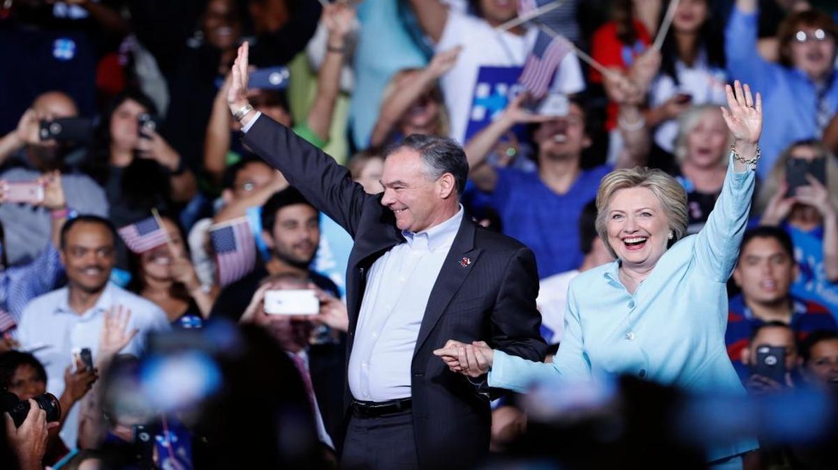 Democratic presidential candidate Hillary Clinton and running mate Sen. Tim Kaine, D-Va., arrive at a campaign rally at Florida International University Panther Arena in Miami on Saturday, July 23, 2016. Kaine addressing the crowd in Spanish reflects the importance of the Latino vote in this election.