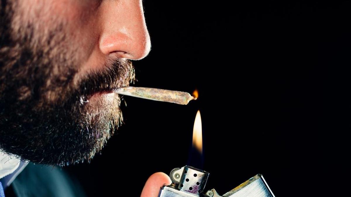 A man smokes a marijuana cigarette. Across the country, pot legalization advocates worry that a victory by Donald Trump on Nov. 8 might mean trouble for legalized recreational pot in Washington state and Colorado, and other states such as California and Nevada that want to follow their lead.