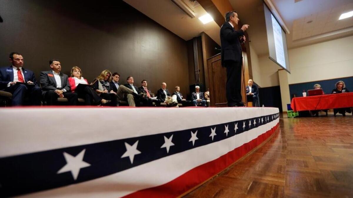 In this Tuesday, Feb. 13, 2018, photo, Matt McCall, standing, and other Republican congressional candidates attend a forum, in New Braunfels, Texas. Texas holds the nation’s first 2018 primary elections Tuesday, March 6, 2018, and the campaign is providing a vivid exhibition of the Trump effect in GOP politics.