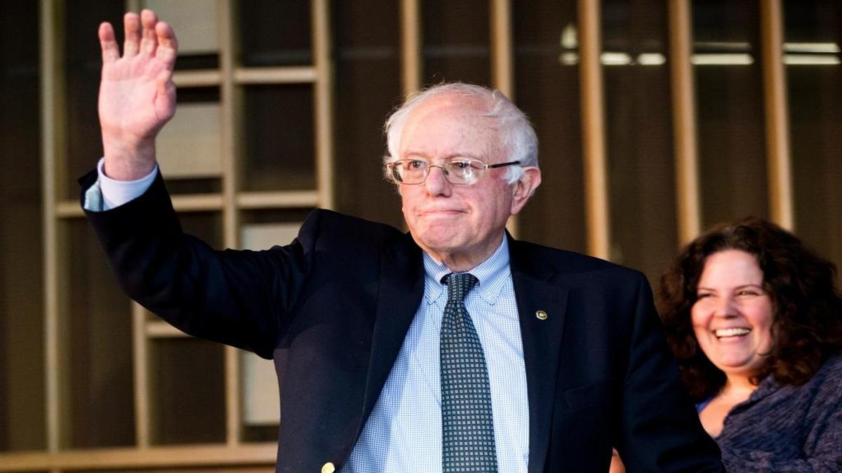 Democratic presidential candidate Sen. Bernie Sanders, I-Vt., waves as he arrives to a community forum at Woodside Church in Flint, Michigan, on Thursday, Feb. 25, 2016.