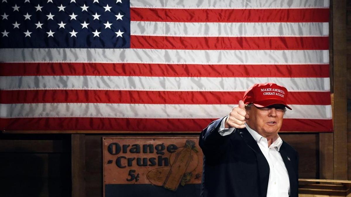 Republican presidential candidate Donald Trump arrives on stage before speaking during a campaign stop on Wednesday, Jan. 27, 2016, in Gilbert, S.C.