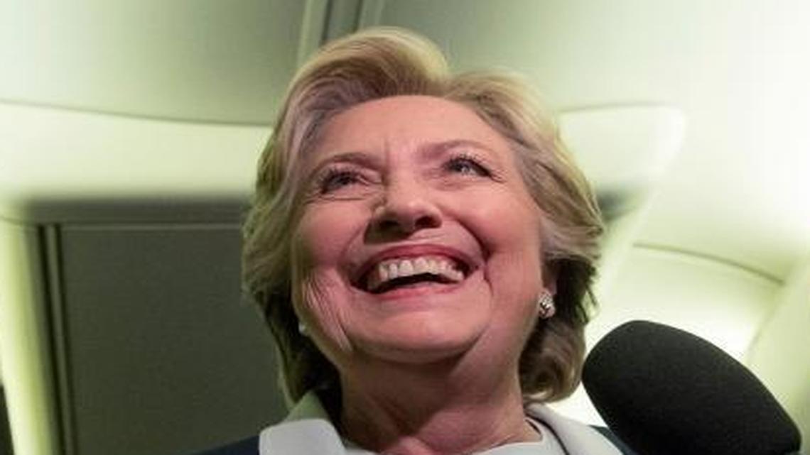 Hillary Clinton aboard her campaign plane at Lambert-St. Louis International Airport in St. Louis following the second presidential debate at Washington University on Sunday, Oct. 9, 2016.