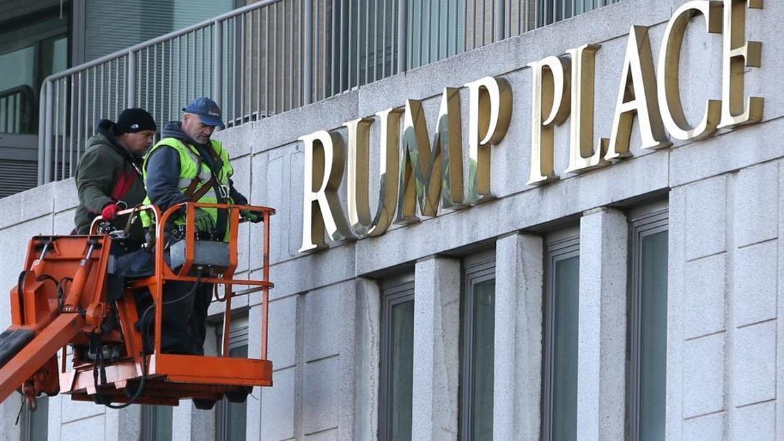 Workmen remove the letters from a building formerly known as Trump Place in New York, Wednesday, Nov. 16, 2016. Donald Trump’s name is being stripped off three luxury apartment buildings after hundreds of tenants signed a petition saying they were embarrassed to live in a place associated with the Republican President-elect.