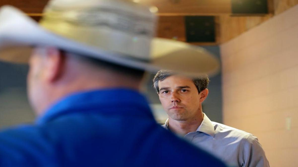 Texas Democratic Congressman Beto O'Rourke, right, listens to a question during a town hall meeting in Alice, Texas.