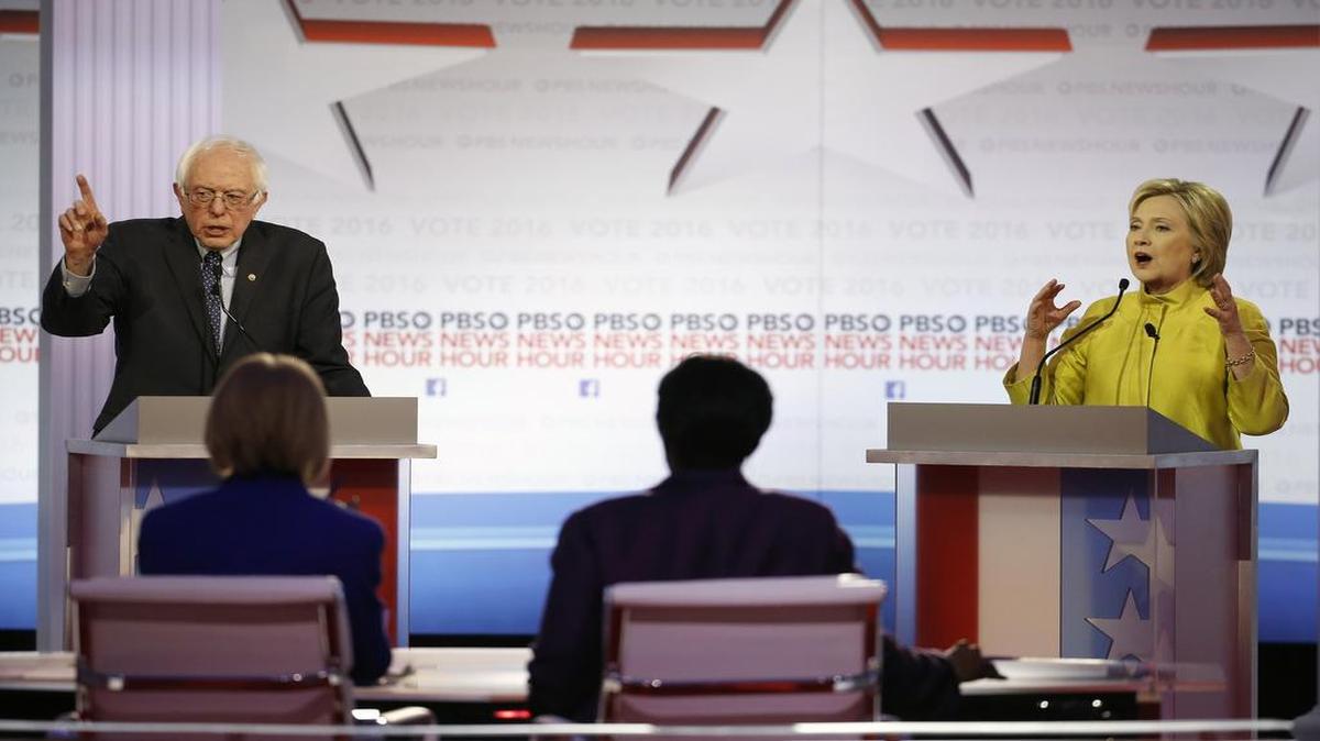 In this Feb. 11, 2016, photo, Bernie Sanders and Hillary Clinton argue a point during a Democratic presidential primary debate at the University of Wisconsin-Milwaukee in Milwaukee.