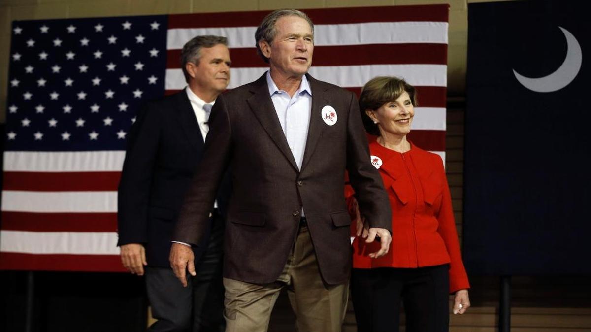 Republican presidential candidate and former Florida Gov. Jeb Bush, left, accompanied by his brother former President George W. Bush, center, and George's wife Laura Bush take the stage during a campaign stop Monday, Feb. 15, 2016, in North Charleston, S.C.