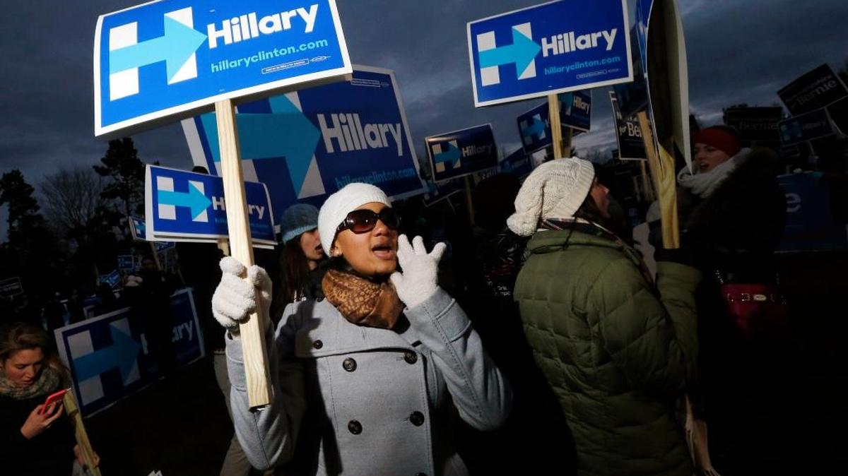 Hillary Clinton supporters rally outside the debate hall before a Democratic presidential primary debate Saturday, Dec. 19, 2015, at Saint Anselm College in Manchester, N.H.
