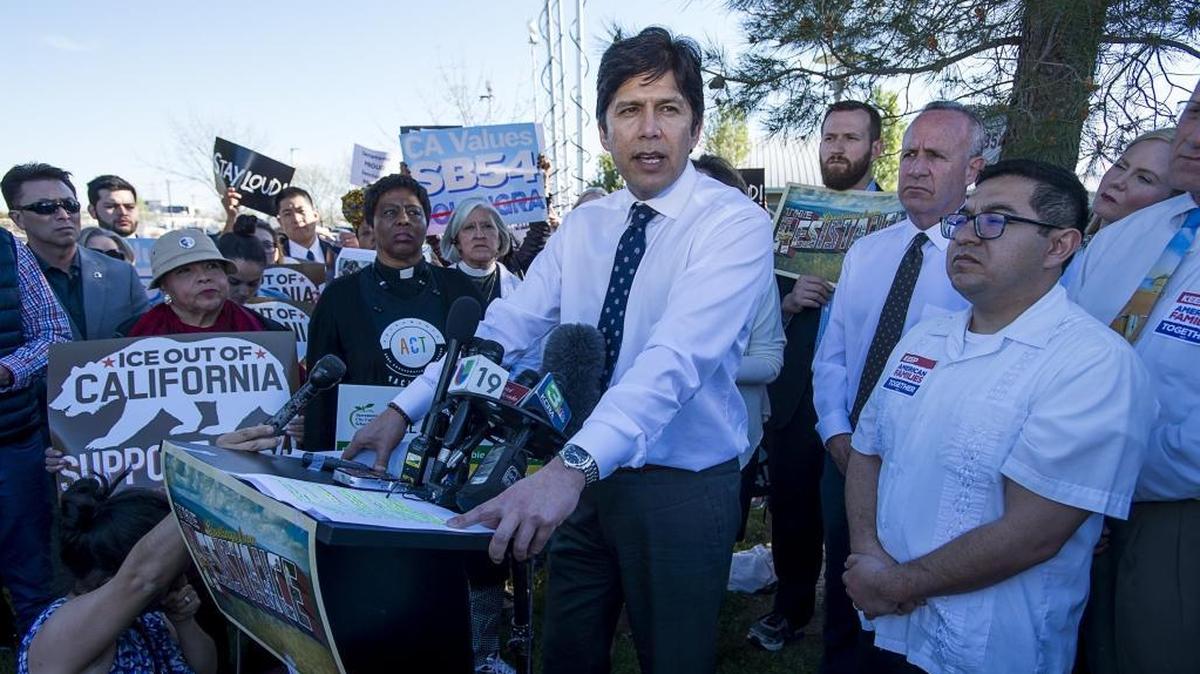 State Senate leader Kevin de Leon speaks to protestors outside of a community immigration forum earlier this year.