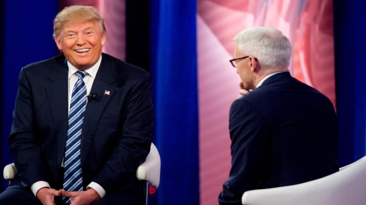 Republican presidential candidate Donald Trump laughs as he speaks with Anderson Cooper at a CNN town hall at the University of South Carolina in Columbia, S.C., Thursday, Feb. 18, 2016.