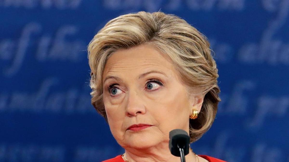 Democratic presidential nominee Hillary Clinton listens to Republican presidential nominee Donald Trump during the U.S. presidential debate at Hofstra University in Hempstead, N.Y.