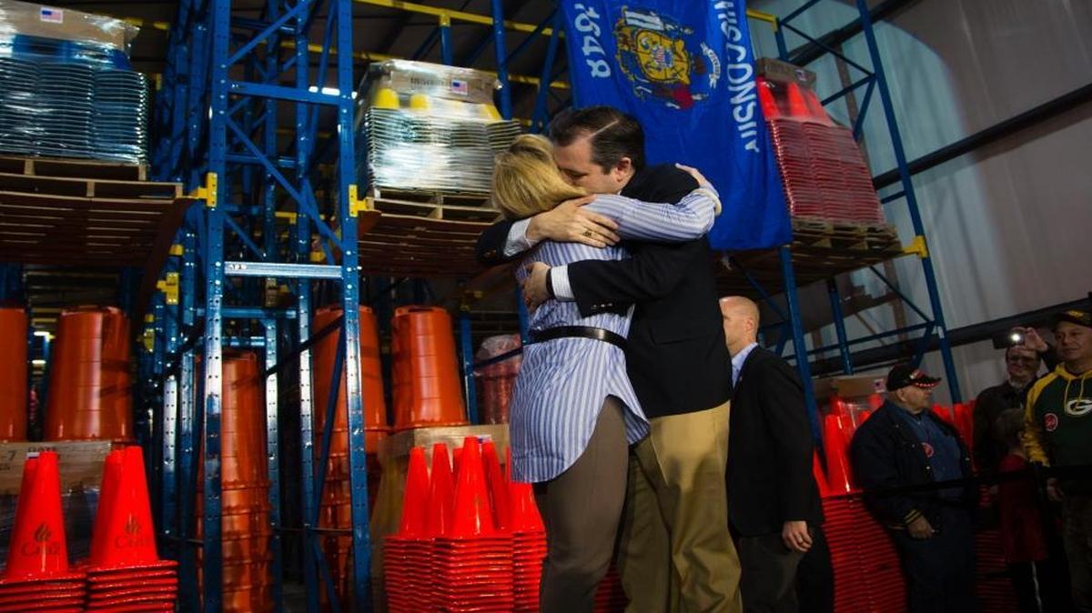 Republican presidential candidate Sen. Ted Cruz, R-Texas, hugs his wife, Heidi Cruz, before speaking at a campaign stop, Friday, March 25, 2016, in Oshkosh, Wis.