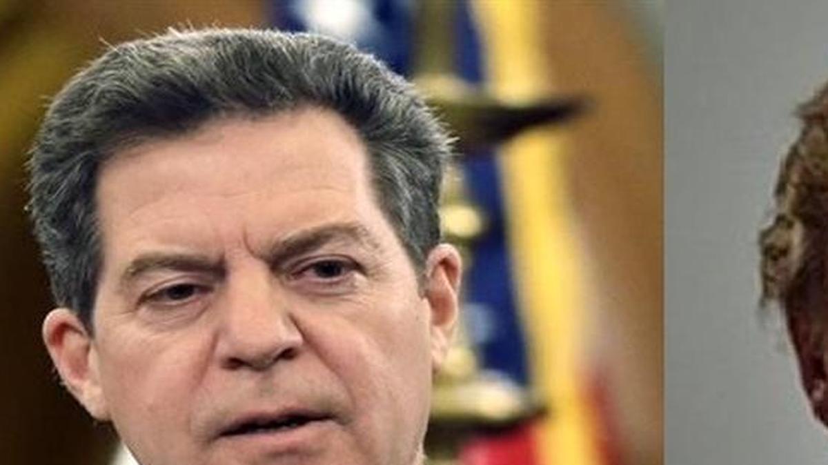 Gov. Sam Brownback, left, says he is happy President-elect Donald Trump intends to implement a tax strategy similar to that of Kansas, only at the national level.