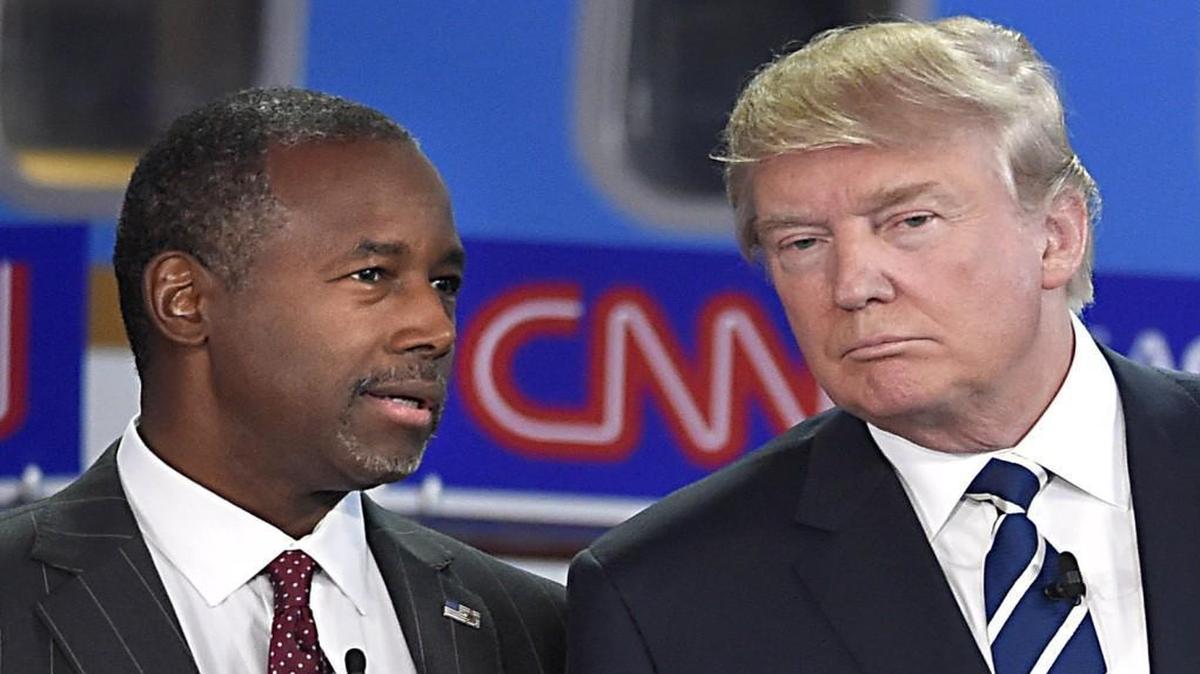 Republican presidential candidates Ben Carson, left, and Donald Trump talk before the start of the CNN Republican presidential debate at the Ronald Reagan Presidential Library and Museum on Wednesday, Sept. 16, 2015, in Simi Valley, Calif.