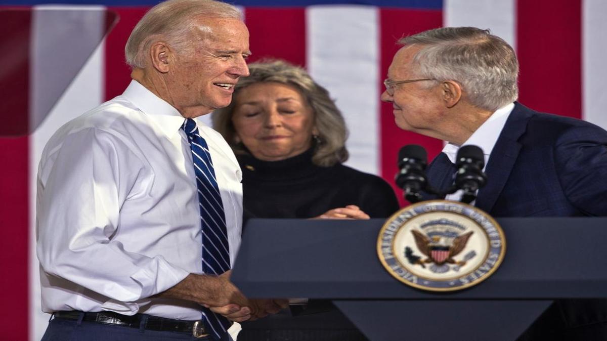 Vice President Joe Biden, left, greets Sen. Harry Reid before speaking at a Hillary for America campaign event at the Southwest Regional Council of Carpenters building, Saturday, Oct. 29, 2016, in Las Vegas.