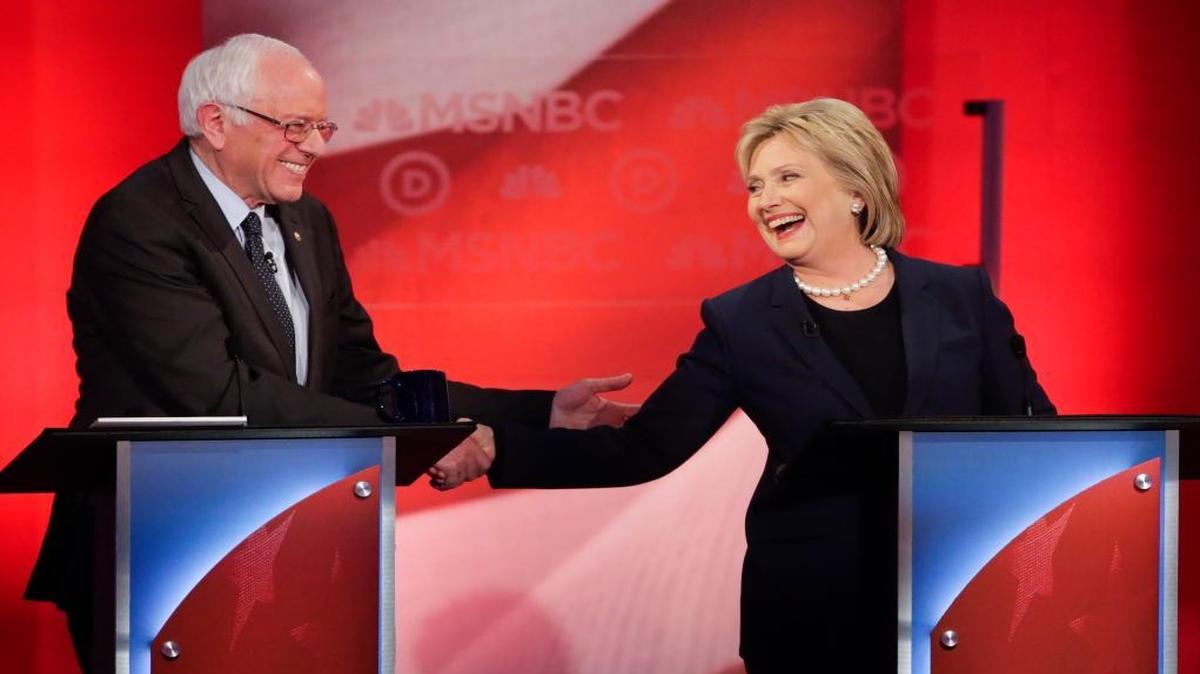 Bernie Sanders and Hillary Clinton shake hands during a Democratic presidential primary debate hosted by MSNBC at the University of New Hampshire on Thursday, Feb. 4, 2016, in Durham, N.H.