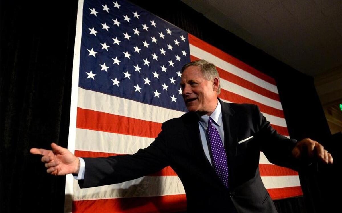 North Carolina U.S. Sen. Richard Burr, R-Winston-Salem, calls staff to the stage for photos following his victory speech at the Forsyth Country Club in Winston-Salem, N.C., on Tuesday, Nov. 8, 2016. Burr defeated Democrat Deborah Ross and he posted the widest win margin of any Republican at the top of the ticket in North Carolina.