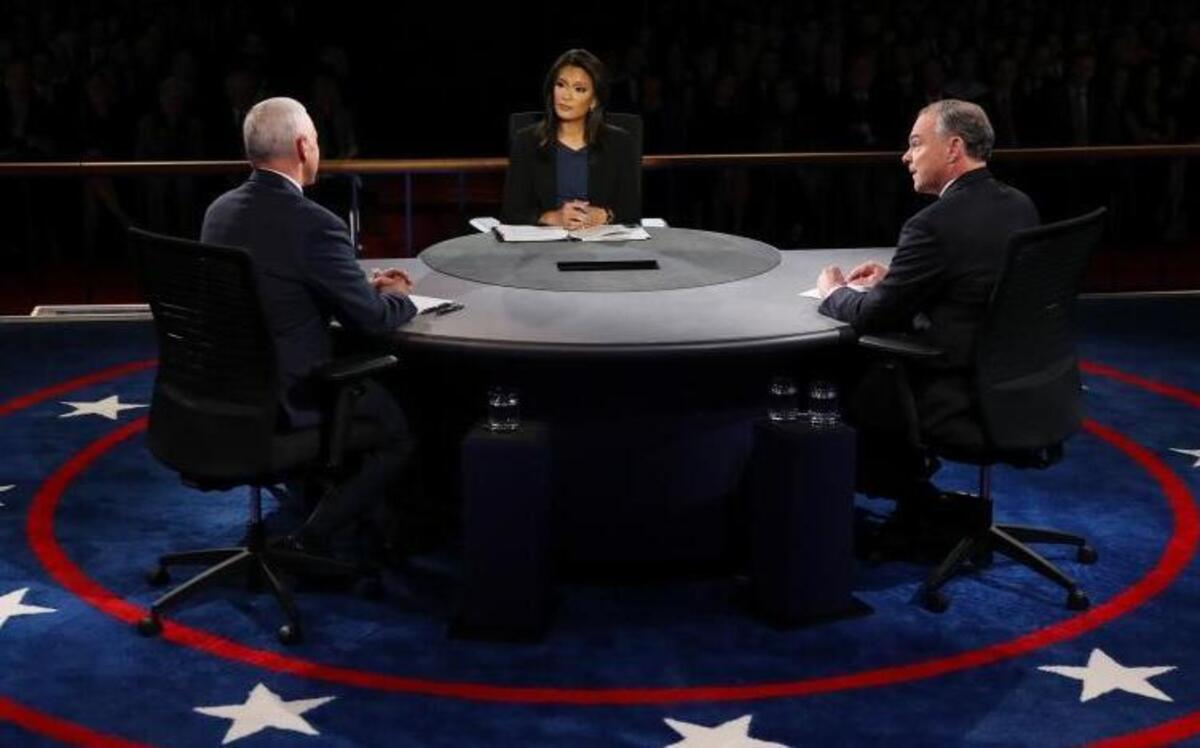 Republican vice-presidential nominee Gov. Mike Pence and Democratic vice-presidential nominee Sen. Tim Kaine discuss a question during the vice-presidential debate at Longwood University in Farmville, Va., Tuesday, Oct. 4, 2016.