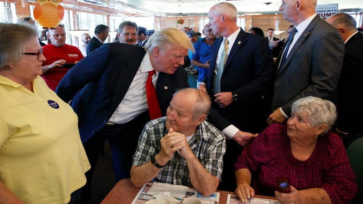 Republican presidential candidate Donald Trump meets with patrons during a visit to the Boulevard Diner on Monday, Sept. 12, 2016, in Dundalk, Md.